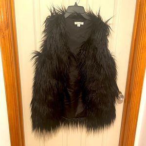 Francesca’s furry black vest